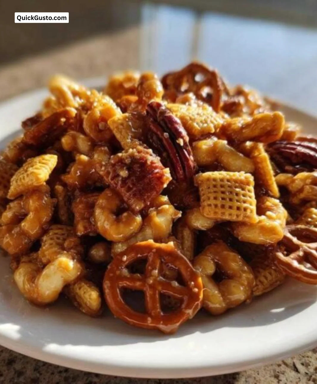 Bowl of homemade Toffee Chex Mix with chocolate and nuts
