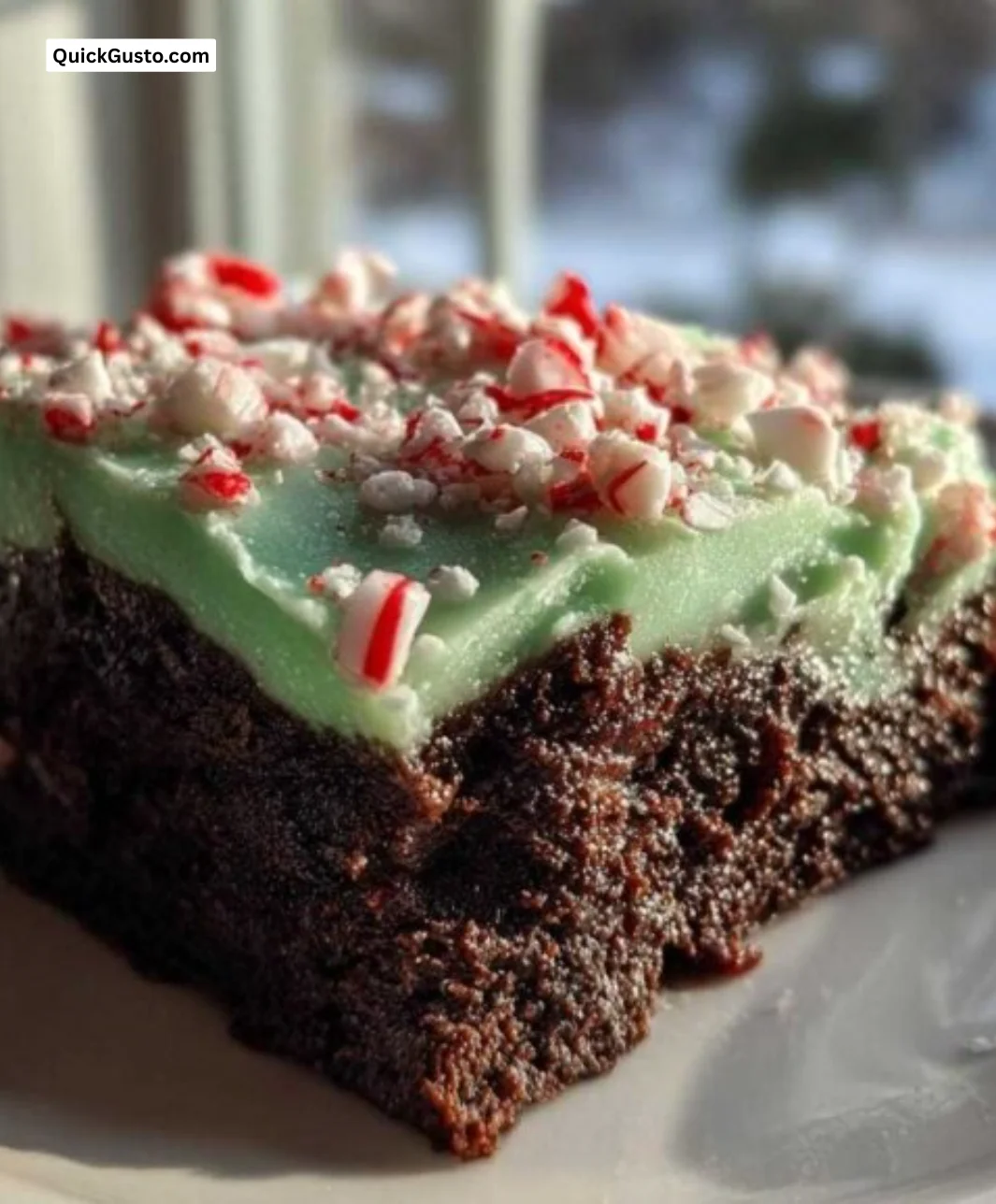Ultimate fudgy peppermint brownies topped with festive sprinkles