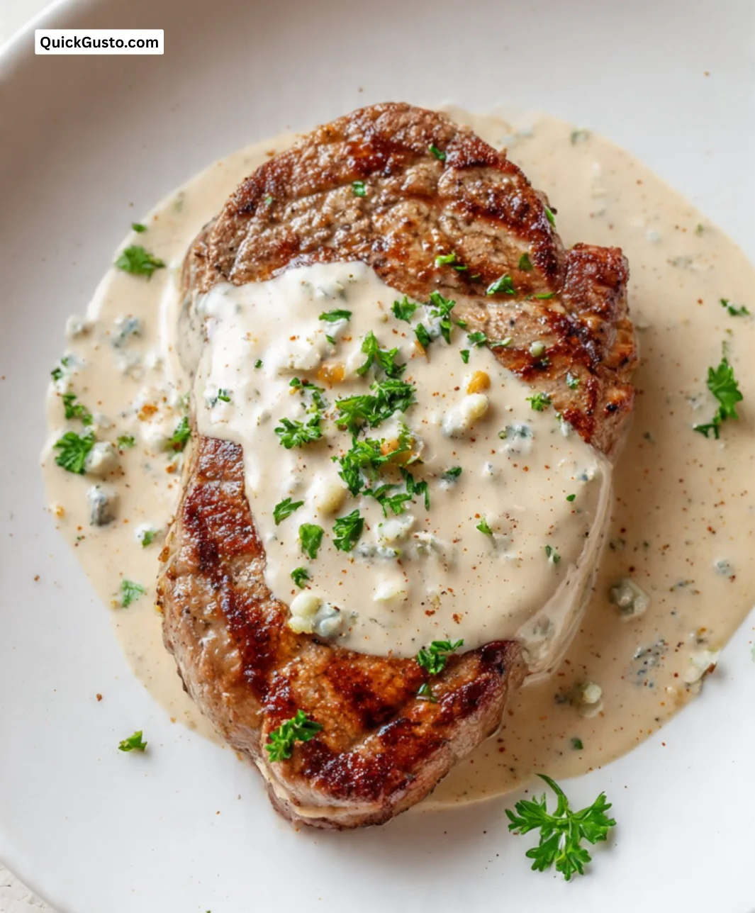 Delicious veal steak with Danablu sauce plated elegantly