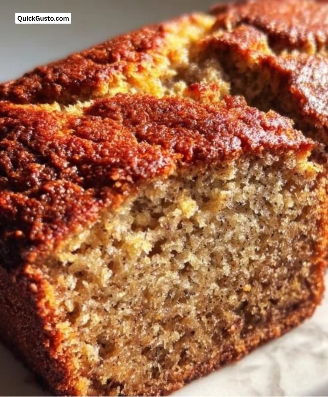 Delicious almond flour banana bread slice on a rustic wooden table