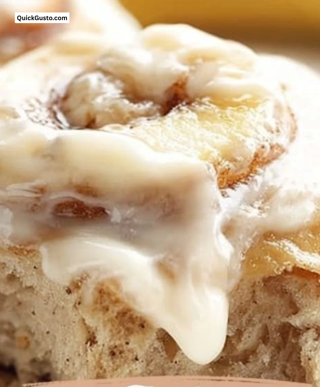 Delicious banana bread cinnamon rolls topped with cream cheese frosting.