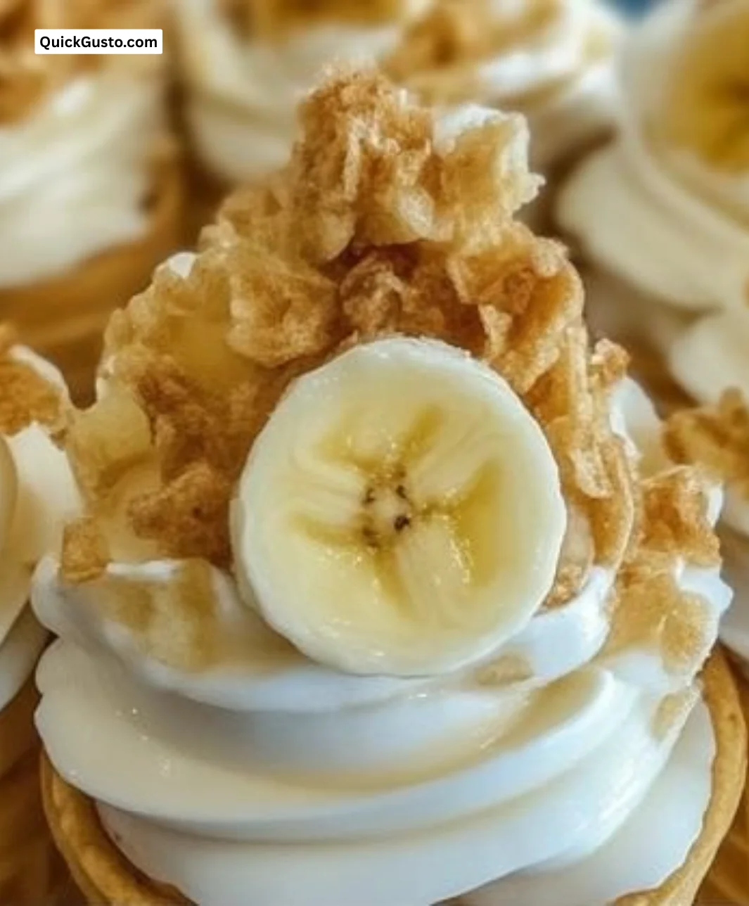 Delicious banana pudding cheesecake cones topped with whipped cream and banana slices