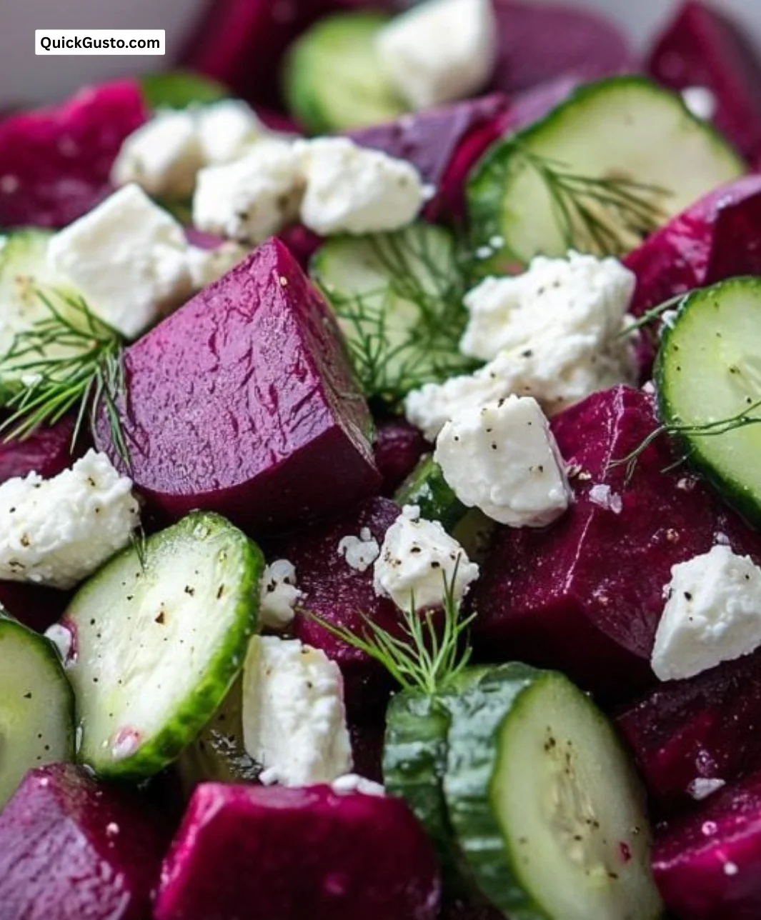 Colorful beet salad with feta cheese, cucumbers, and fresh dill