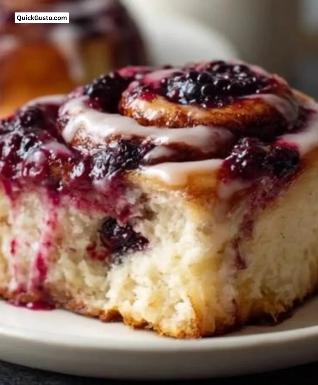 Freshly baked Blackberry Cinnamon Rolls with blackberries and cinnamon glaze
