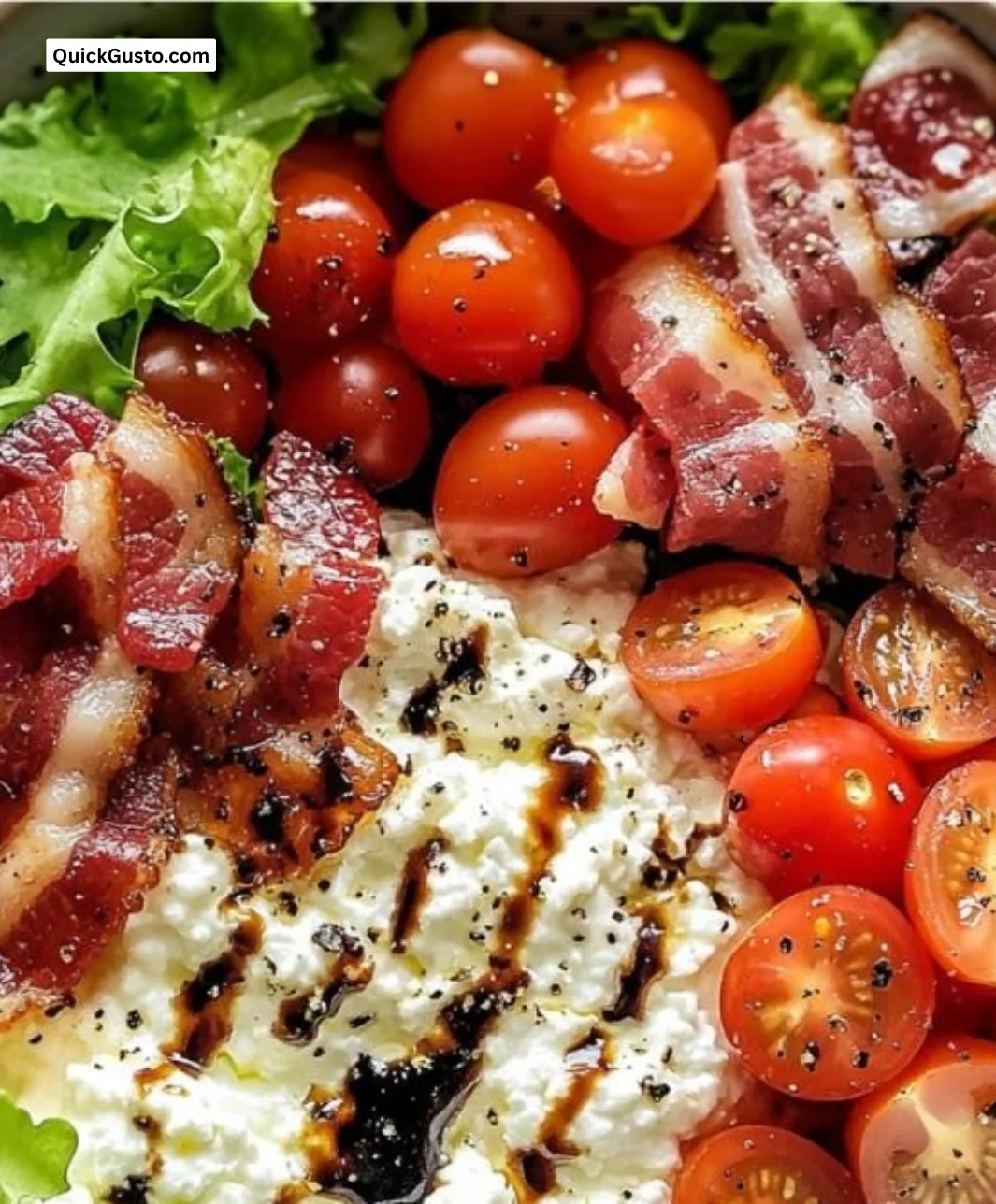 Bowl of BLT Cottage Cheese topped with crispy bacon, lettuce, and tomatoes
