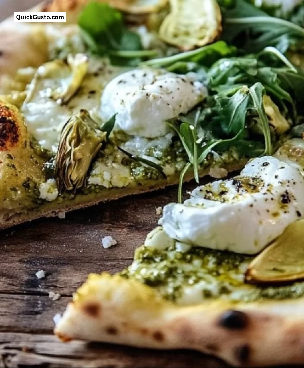 Burrata Artichoke Pesto Pizza topped with creamy burrata cheese and fresh artichokes
