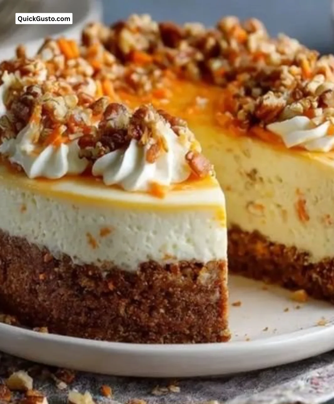 Delicious slice of carrot cake cheesecake topped with cream cheese frosting