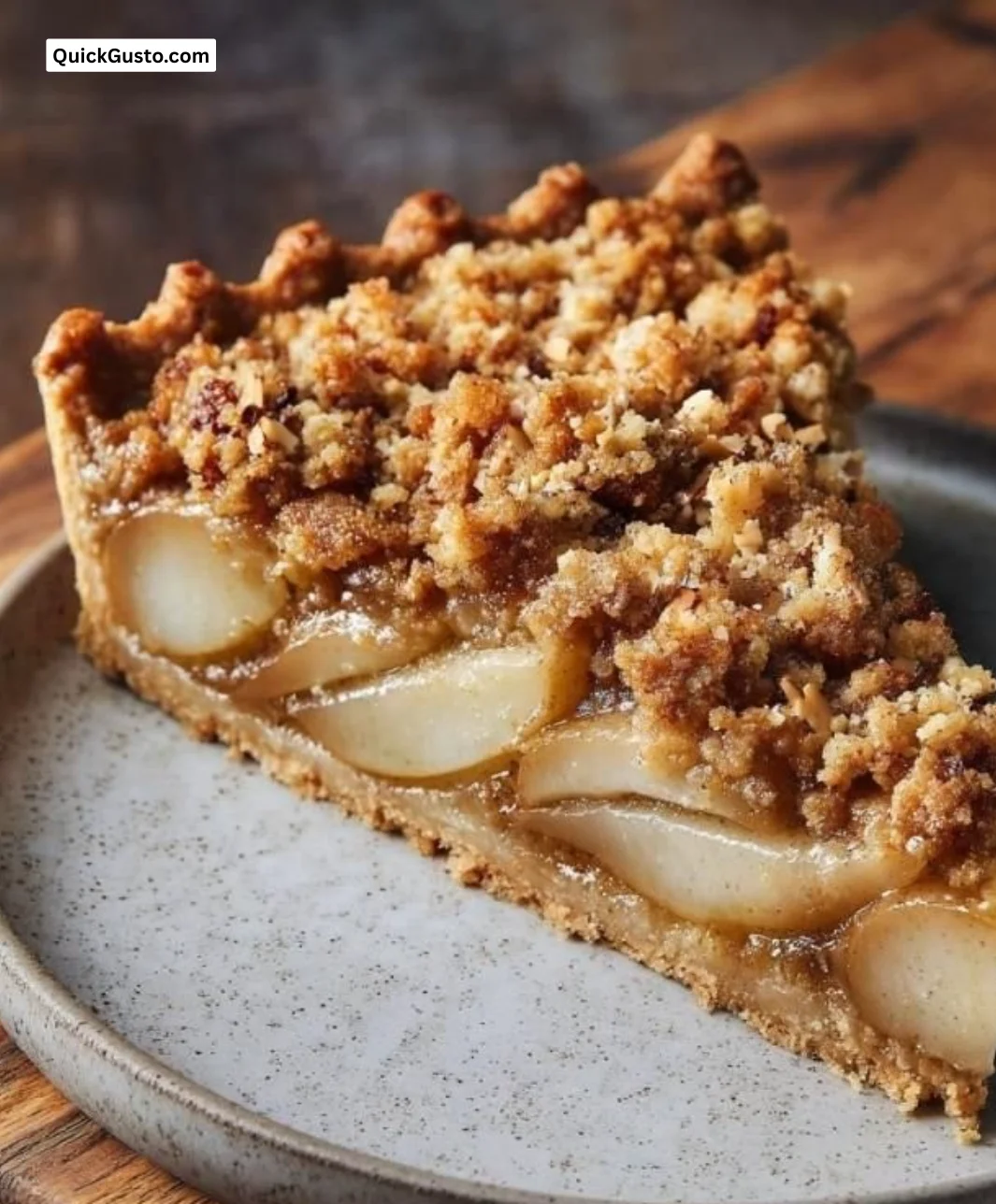 Chai spiced pear almond crumble tart with a golden crust and fresh pears