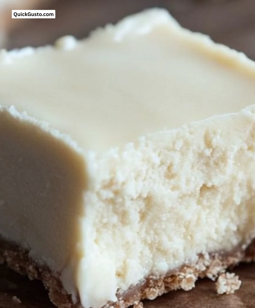 Delicious homemade cheesecake fudge cut into squares on a plate