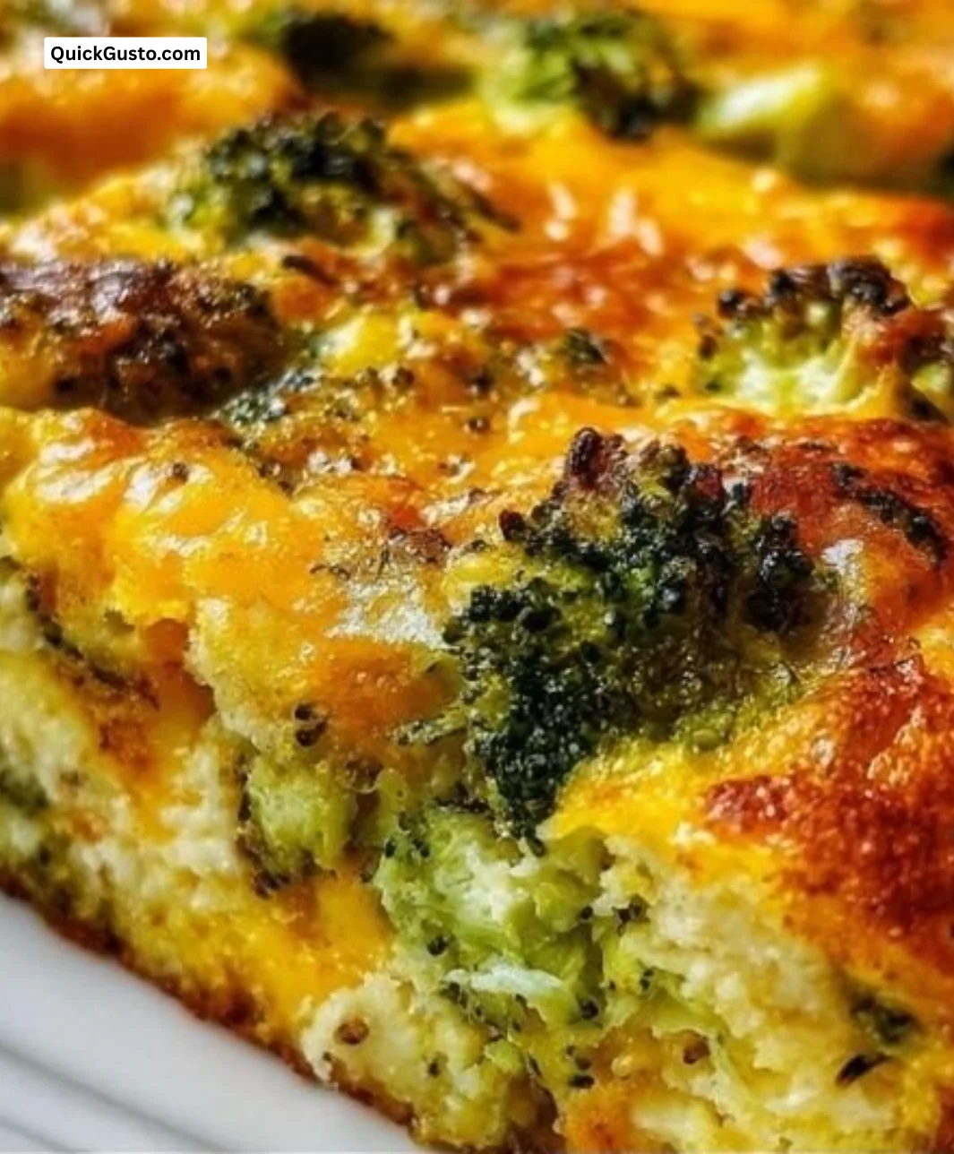 Cheesy broccoli egg bake fresh from the oven, topped with melted cheese.