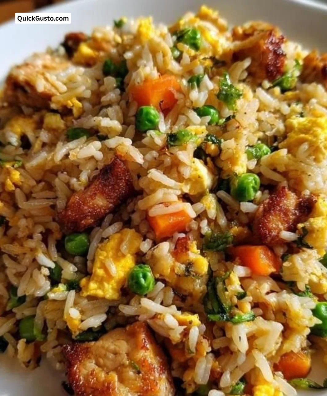 Plate of savory Chicken Fried Rice with chicken, vegetables, and spices