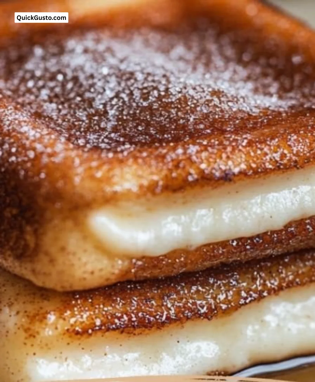 Delicious churro stuffed French toast topped with cinnamon sugar