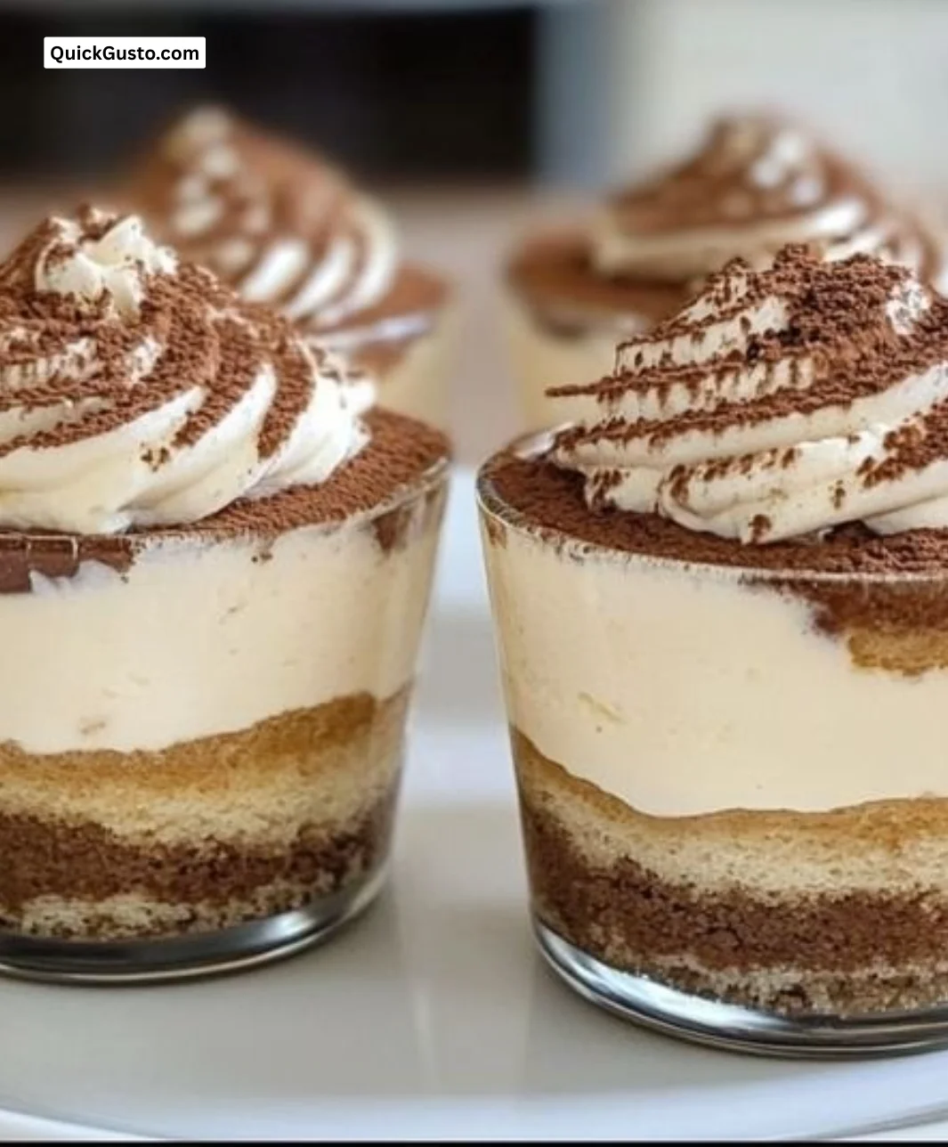Delicious classic tiramisu cups with cocoa and coffee layers