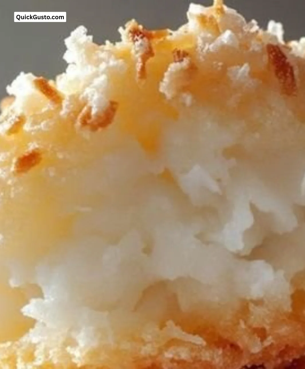 Delicious coconut macaroons stacked on a plate, perfect sweet treat.