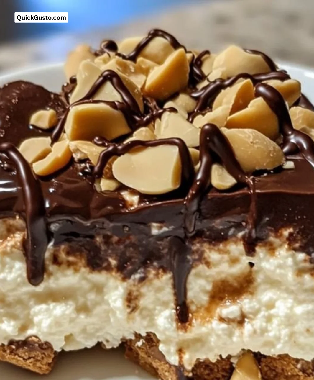 Cottage Cheese Peanut Butter Snickers Dessert garnished with chocolate and nuts