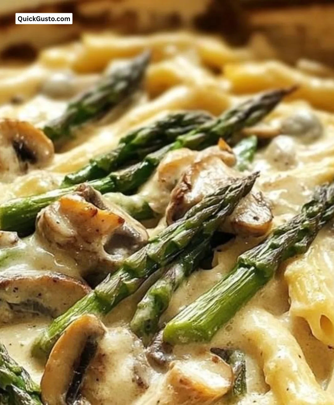 Creamy asparagus and mushroom bake dish garnished with herbs.