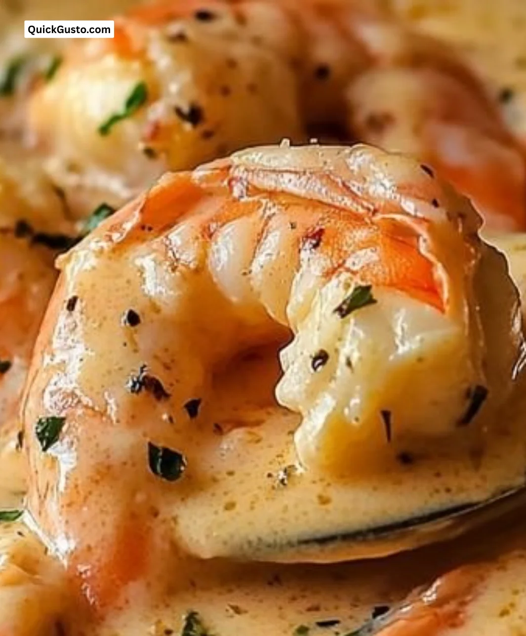 A bowl of creamy crab and shrimp seafood bisque garnished with herbs