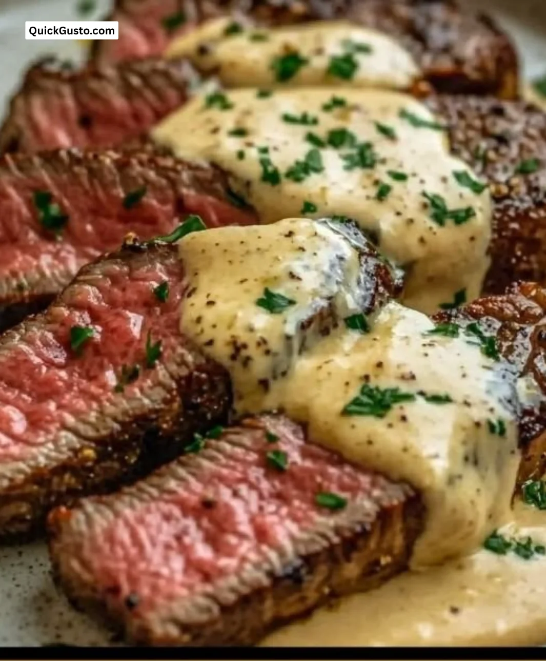 Creamy garlic sauce drizzled over a perfectly cooked steak