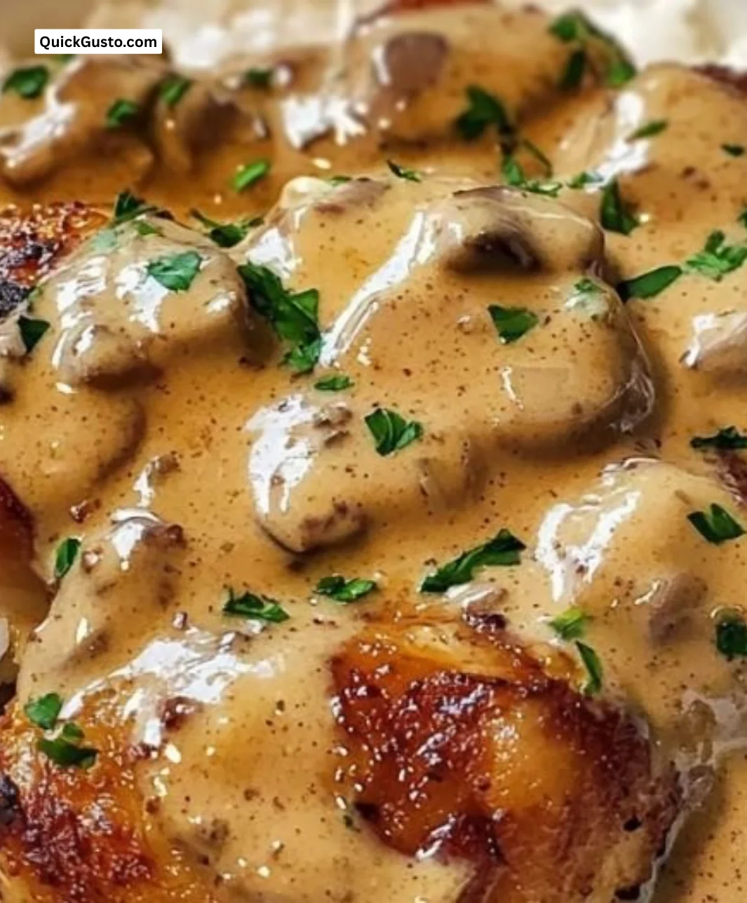 Delicious creamy smothered chicken served over rice for a comforting meal