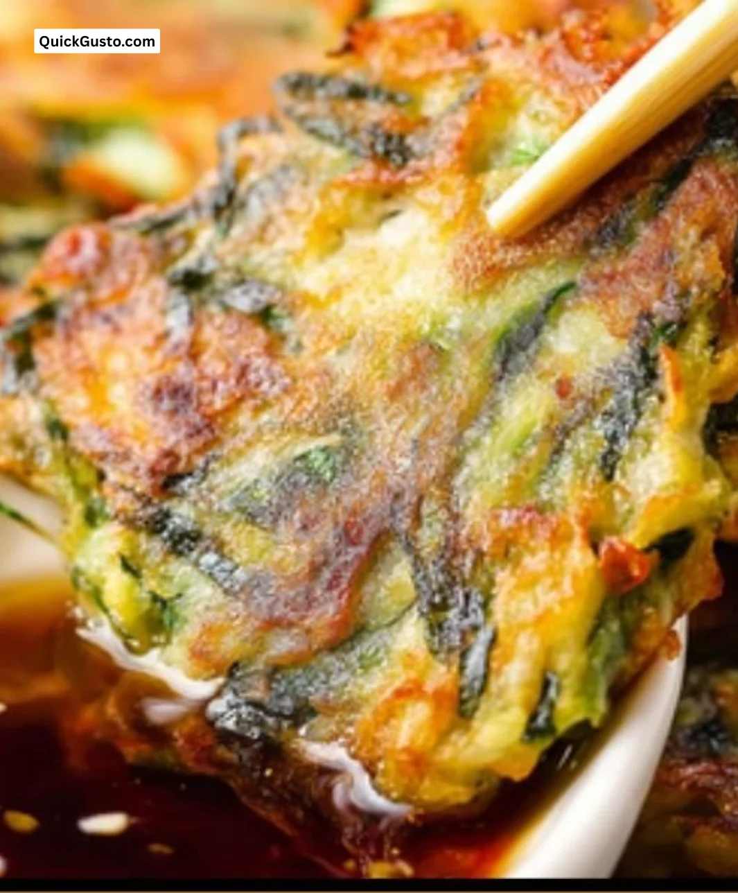 Plate of crispy vegetable pancakes served with Asian dipping sauce