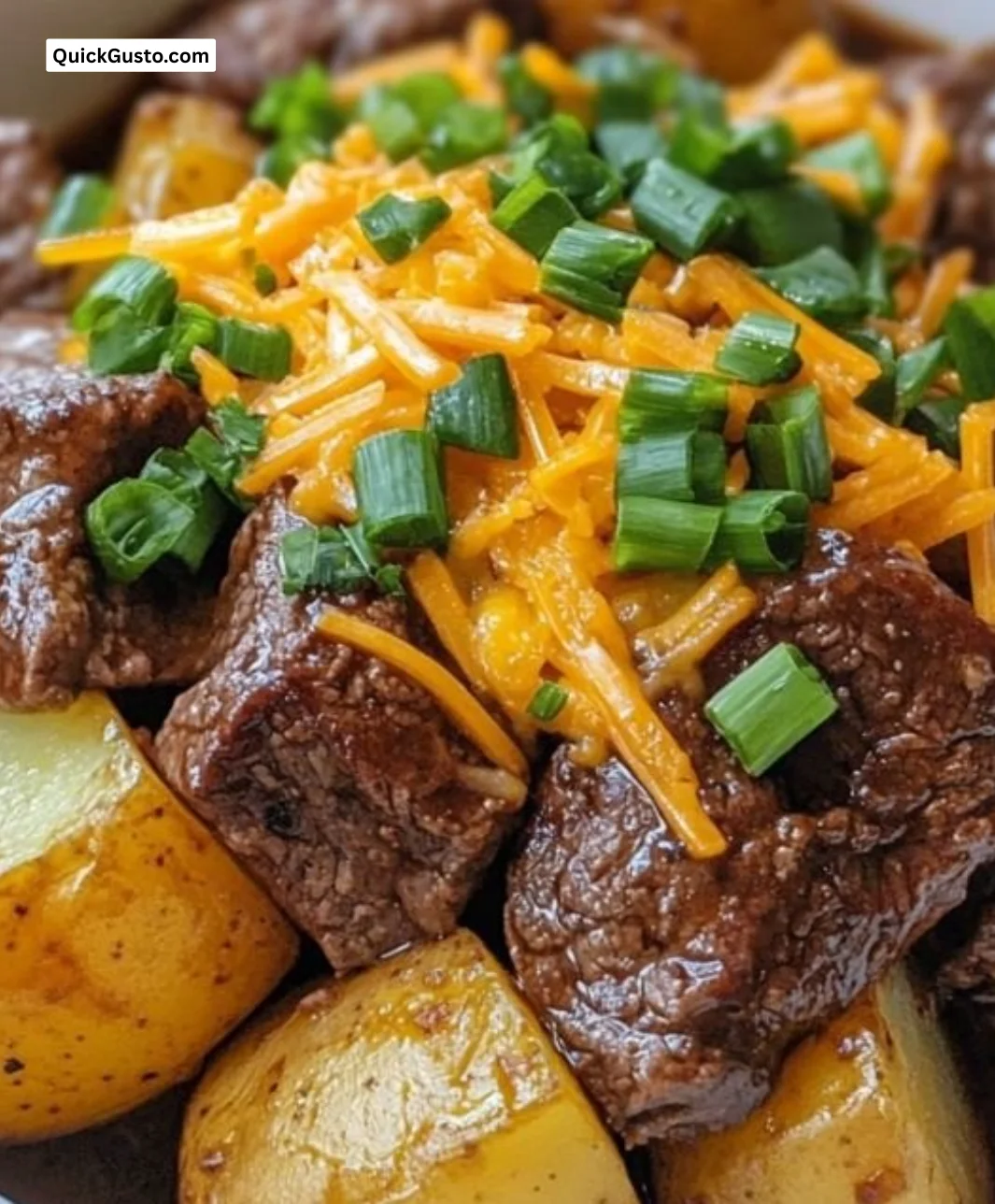Crockpot Loaded Steak and Potato Bake with melted cheese and herbs
