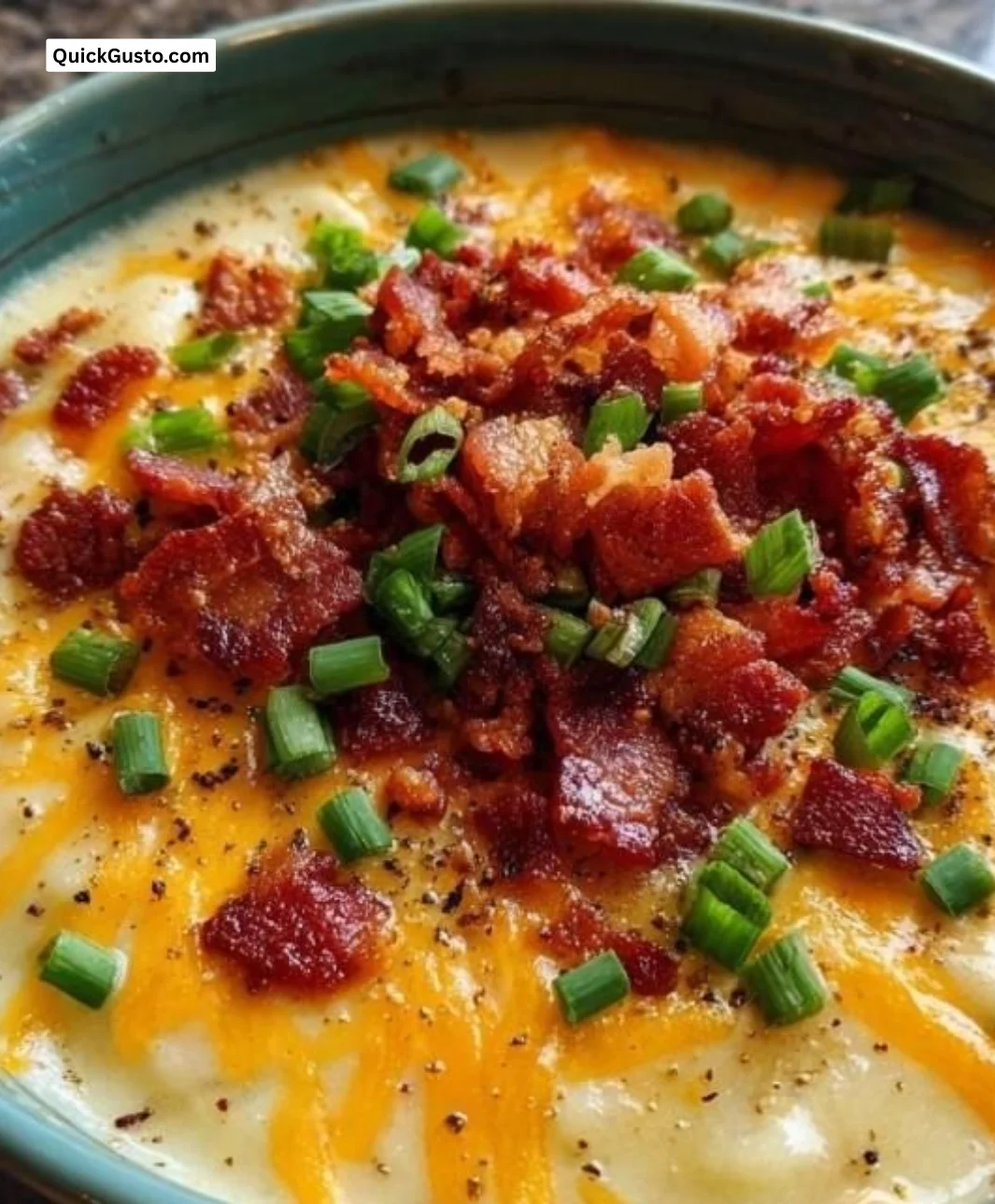 Delicious bowl of creamy Crockpot potato soup topped with green onions