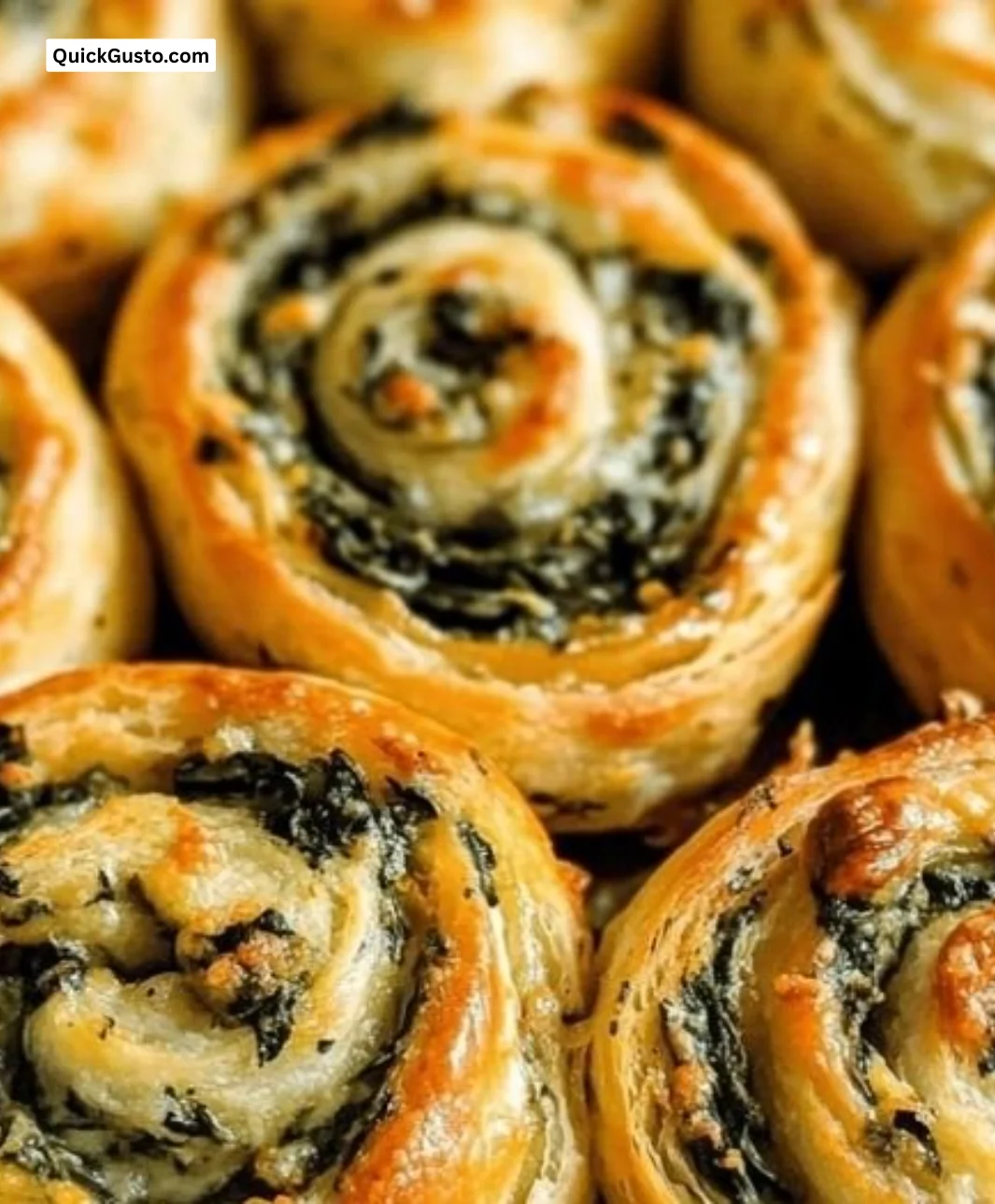 Delicious easy cheesy spinach pinwheels served on a platter