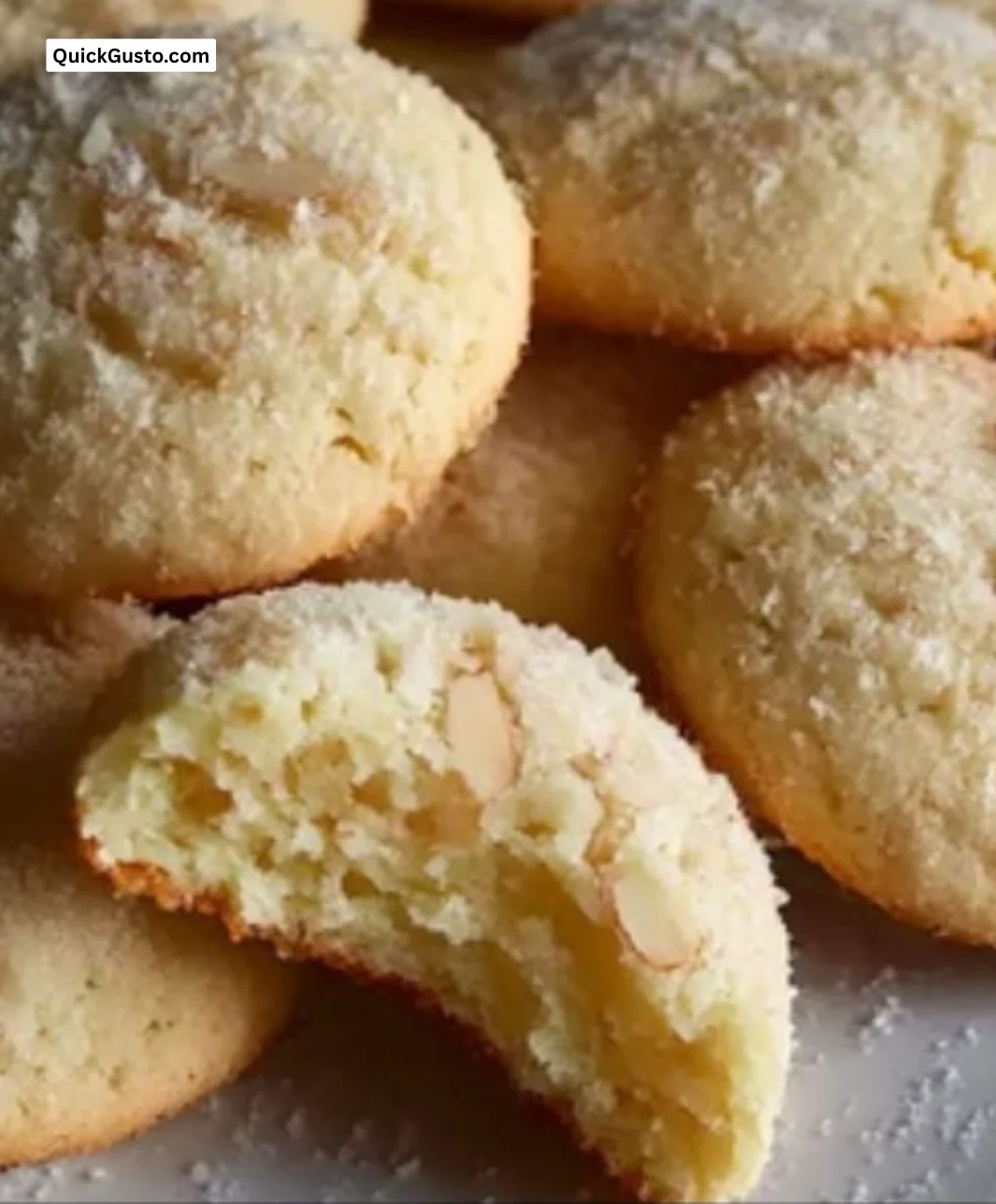 Deliciously soft almond ricotta cookies on a plate