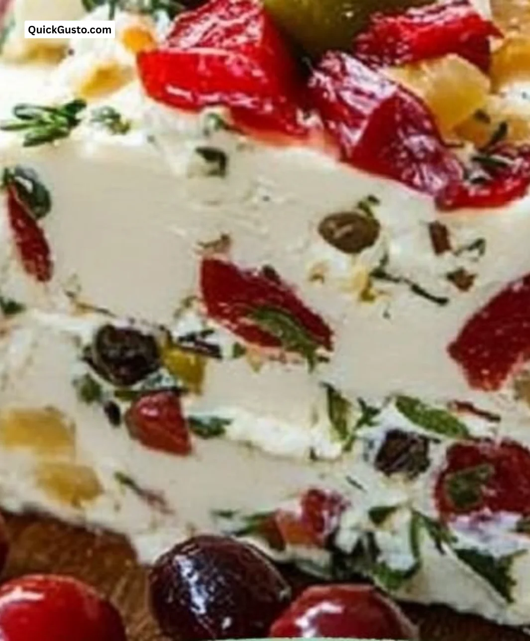 Festive holiday antipasto cream cheese log served on a platter