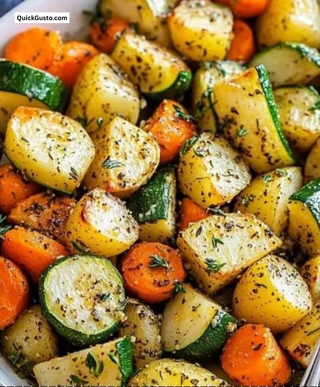 Golden garlic herb roasted vegetables served in a bowl