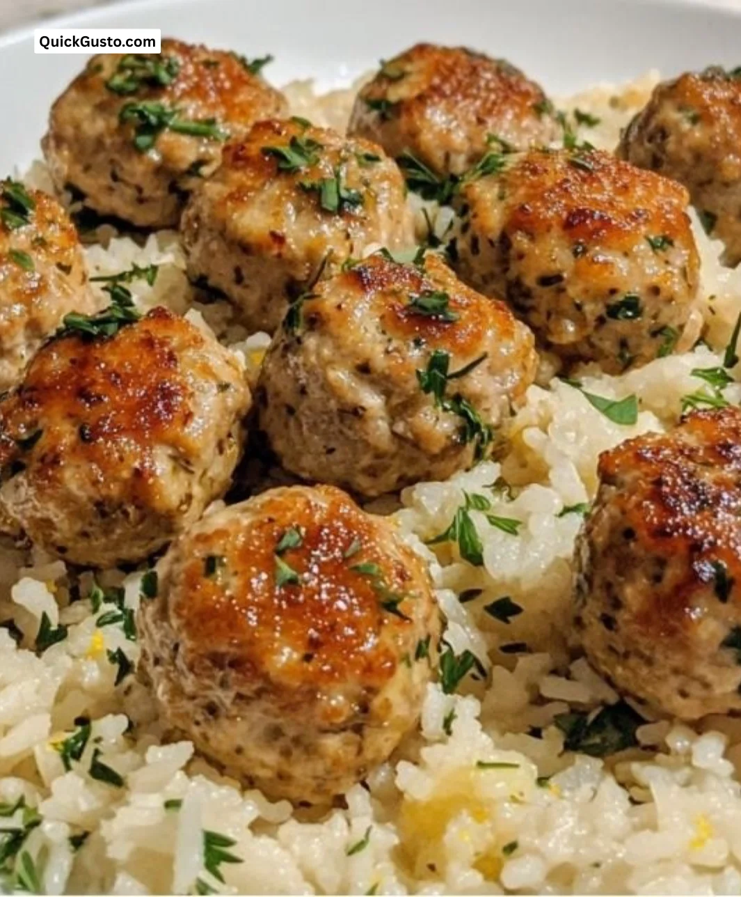 Greek turkey meatballs with lemon herb rice, a healthy and flavorful dish.