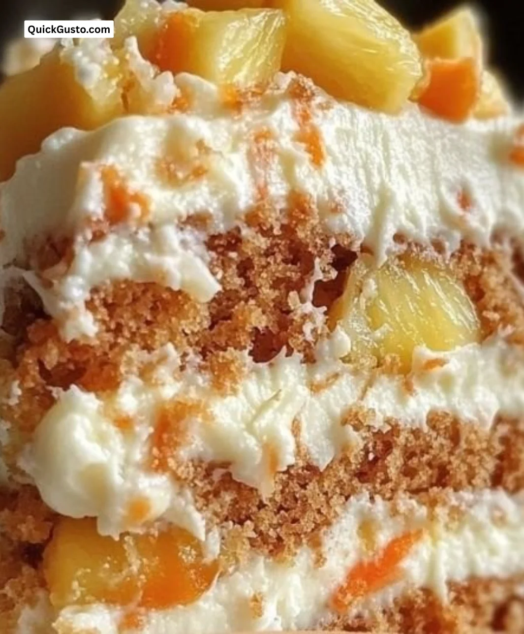 Slice of Hawaiian Carrot Pineapple Cake with tropical fruits and cream cheese frosting