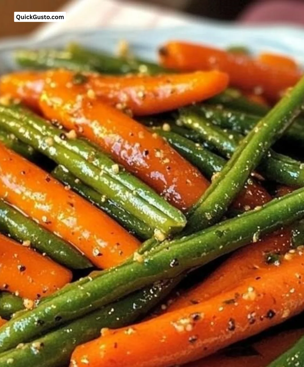 Honey glazed carrots served with green beans on a plate