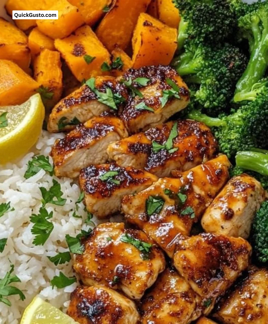 Delicious Hot Honey Chicken Bowls garnished with fresh herbs and vegetables.