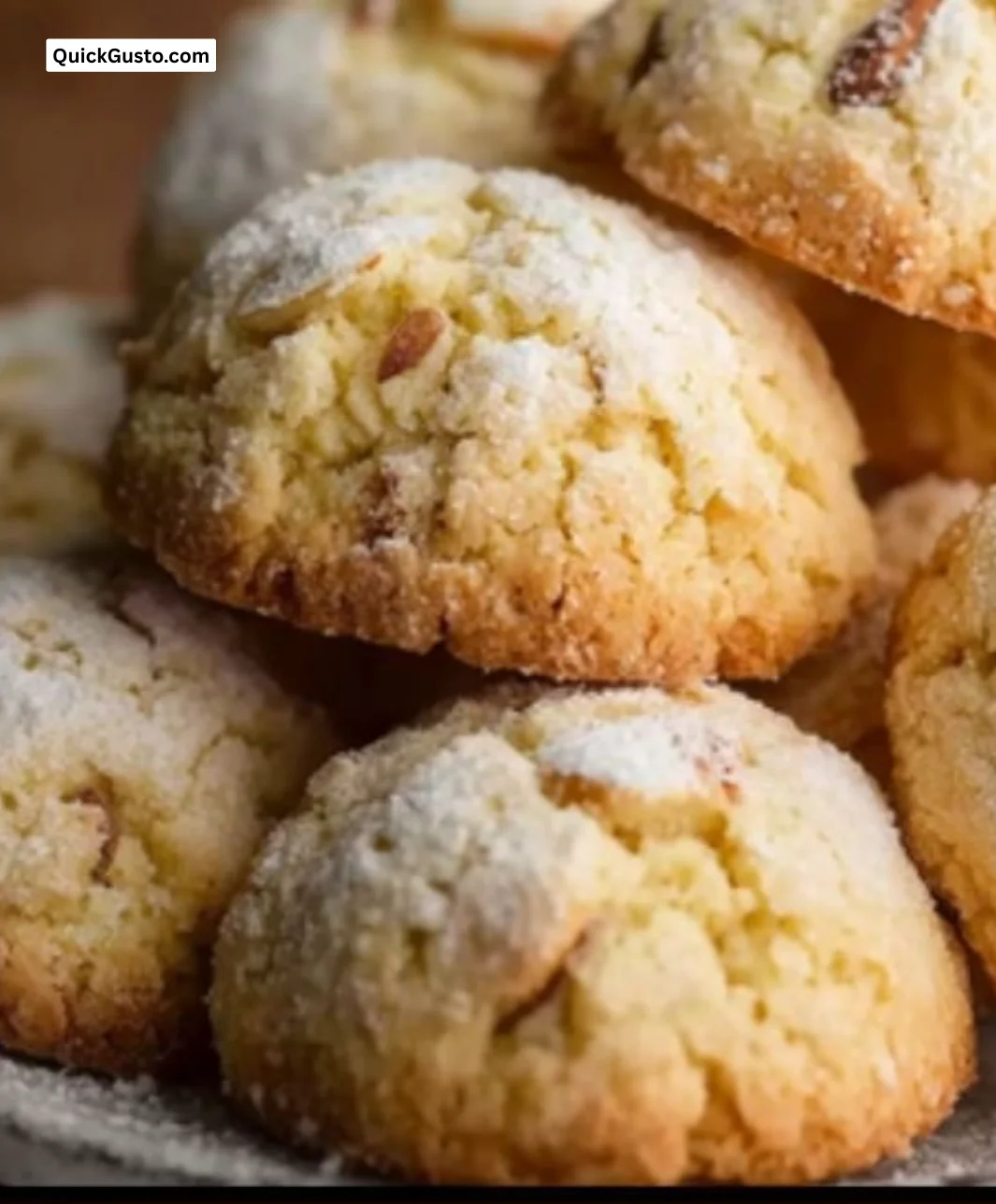Freshly baked Italian almond sugar cookies on a cooling rack.