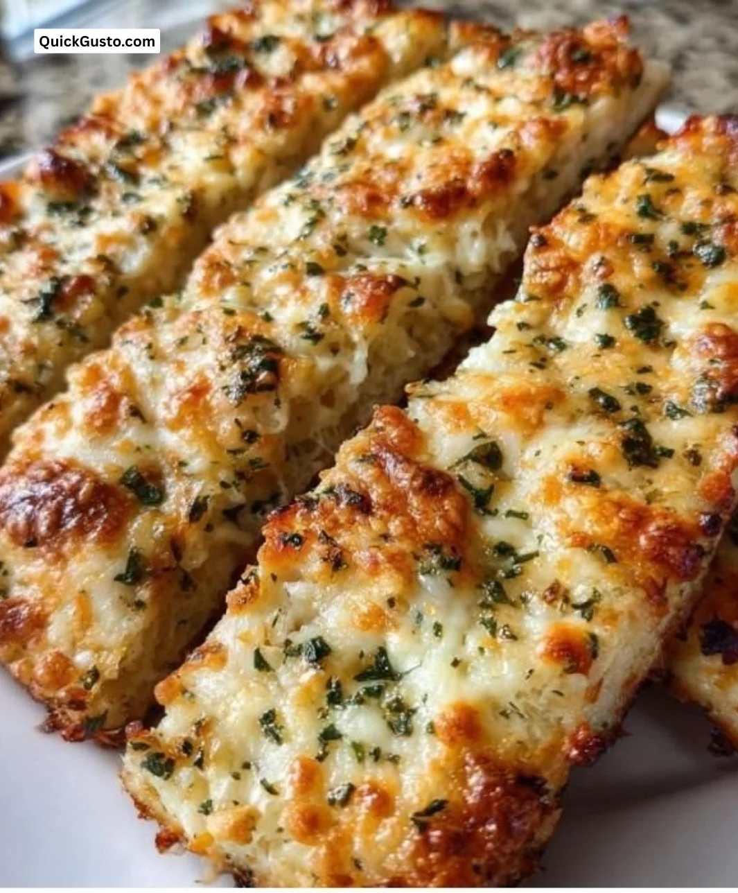 Delicious keto cauliflower garlic breadsticks on a plate