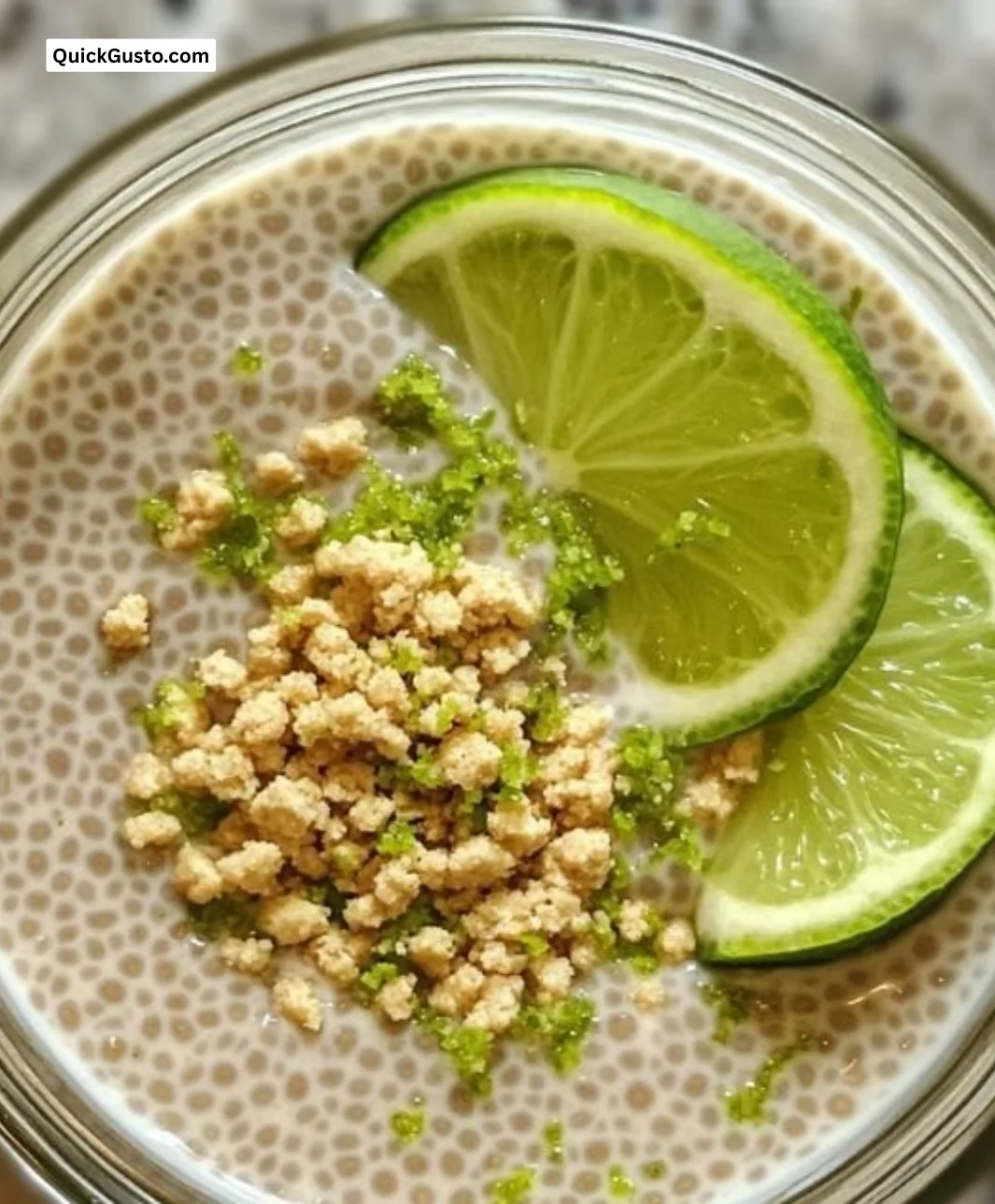 Key Lime Pie Chia Pudding topped with fresh lime and coconut flakes