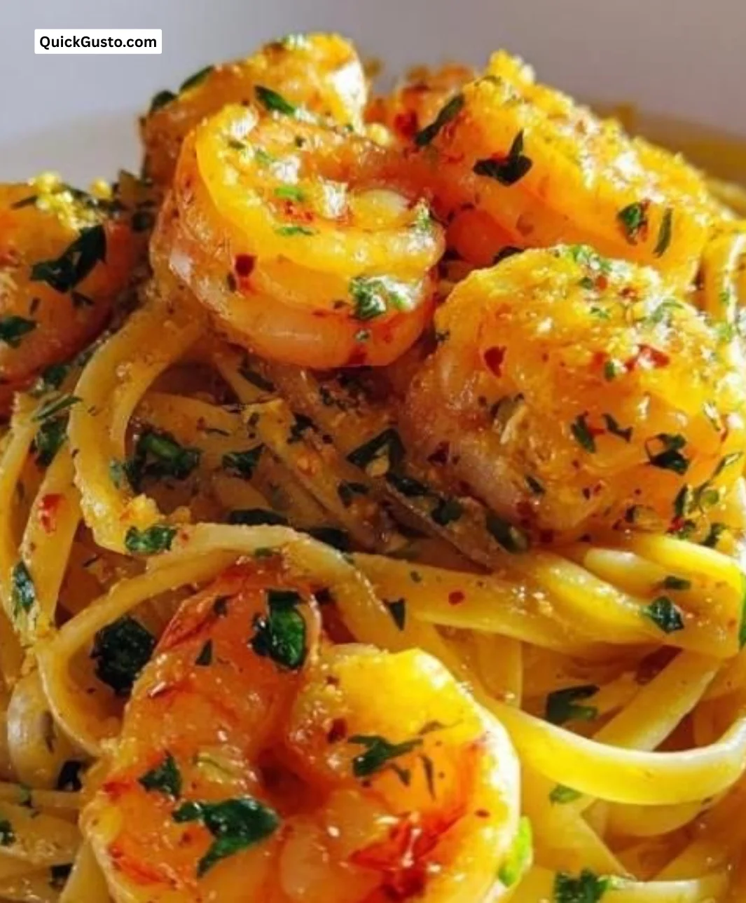Lemon Butter Shrimp Pasta garnished with herbs and lemon slices