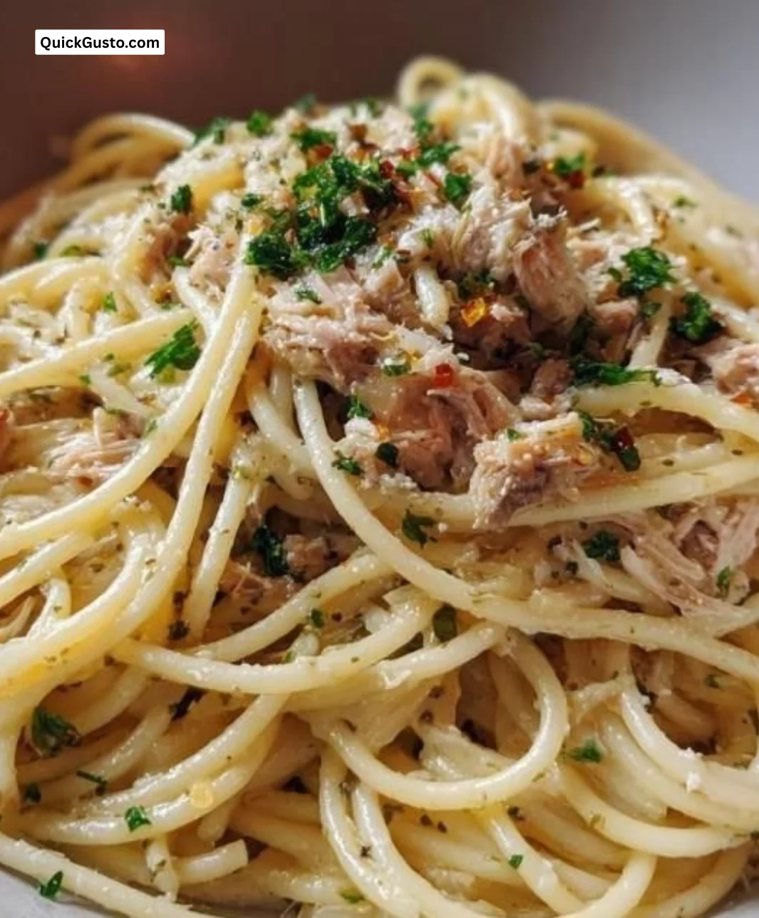 Lemon Garlic Tuna Pasta dish garnished with herbs and served in a bowl