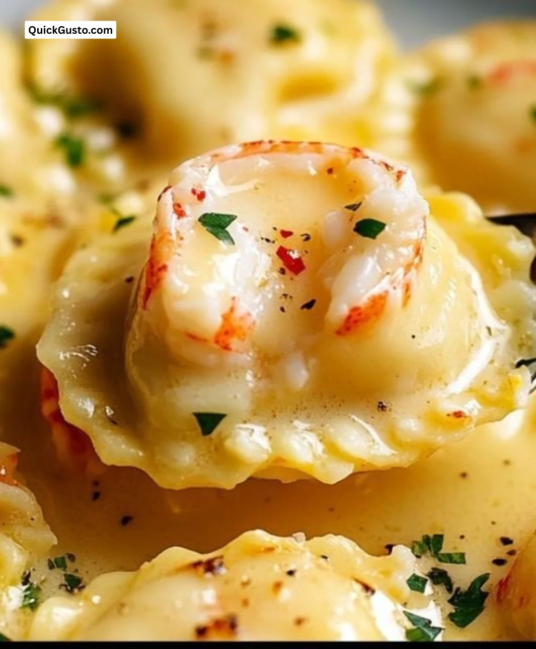 Plate of lobster ravioli served with lemon butter sauce