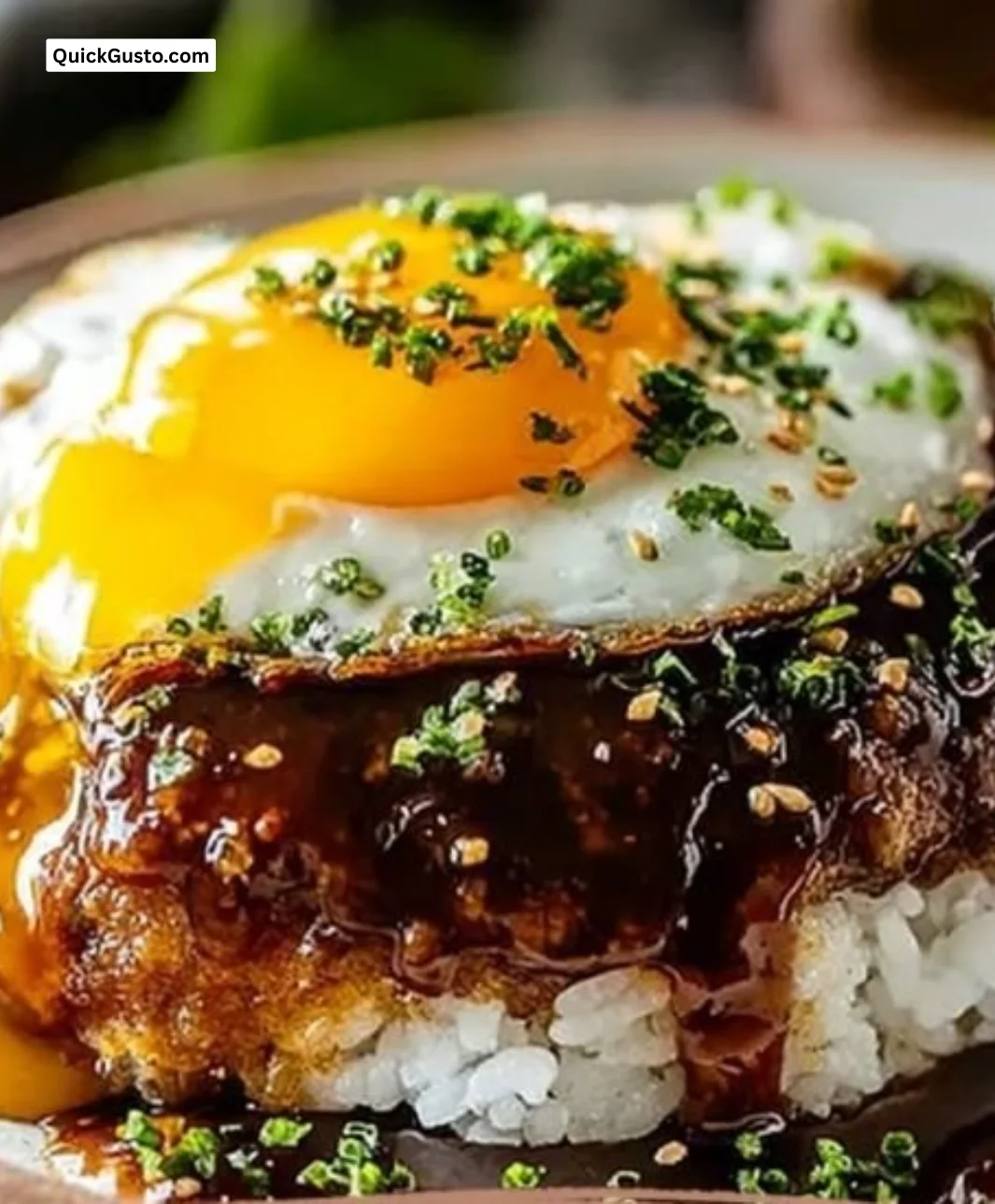 Delicious loco moco with rice, hamburger patty, and gravy served in a bowl