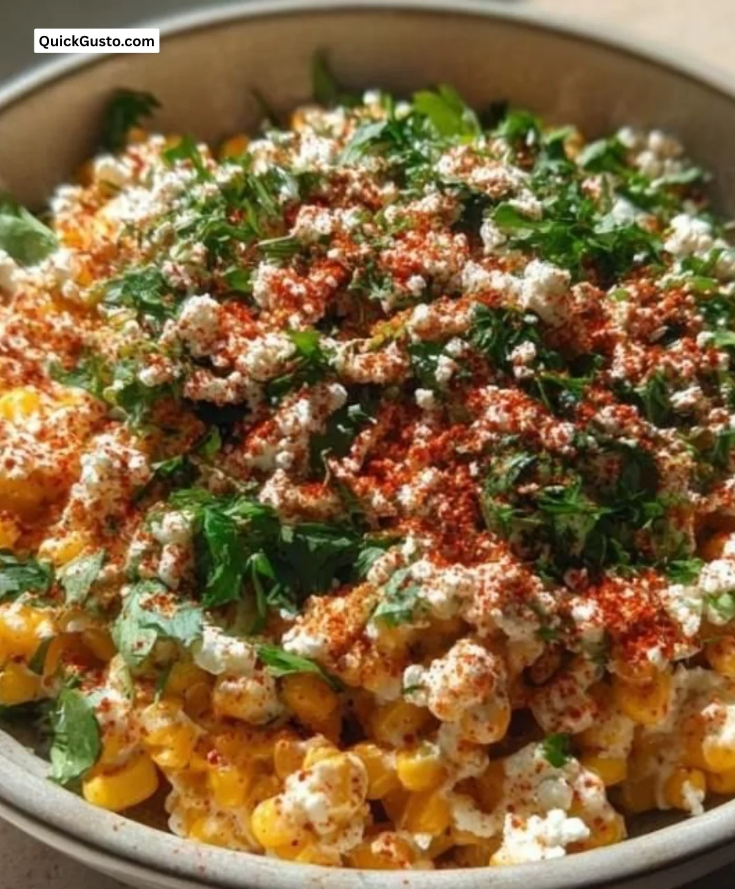 Delicious Mexican street corn bowl topped with cheese and spices