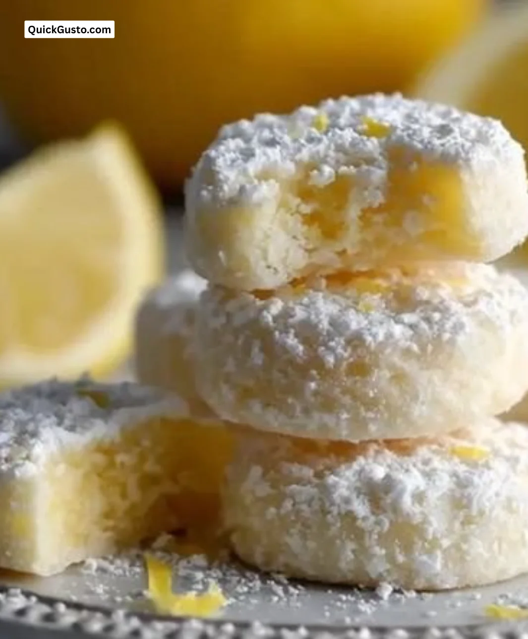 Delicious Meyer Lemon Meltaways on a plate, showcasing their bright yellow color.