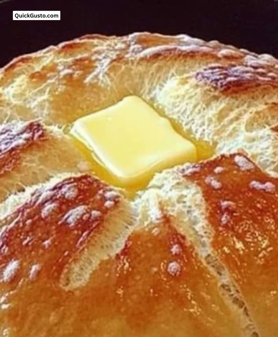 Freshly baked stovetop bread cooling on a wooden surface