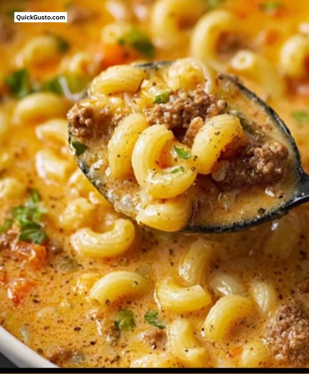 Delicious one-pot macaroni cheeseburger soup served in a bowl with toppings.
