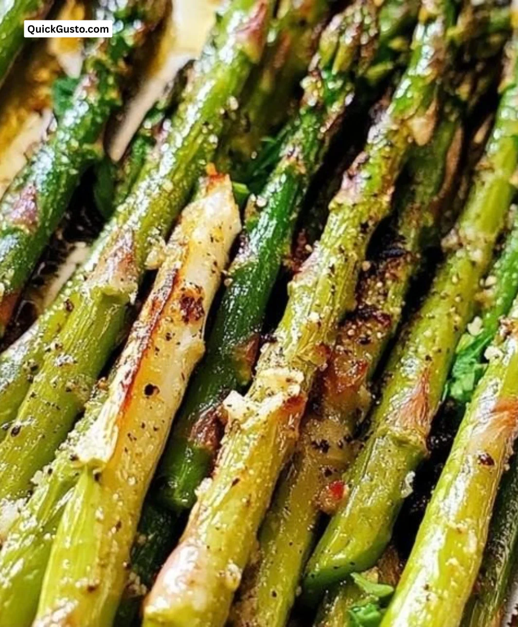 Plate of oven roasted asparagus garnished and ready to serve.