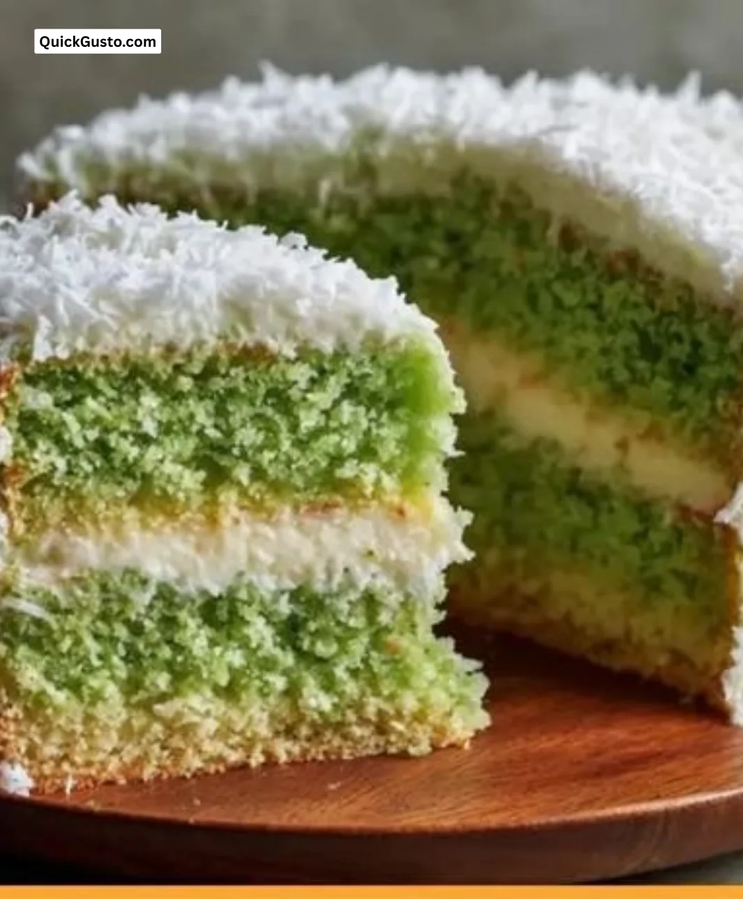 Delicious slice of Pandan Coconut Cake topped with coconut flakes