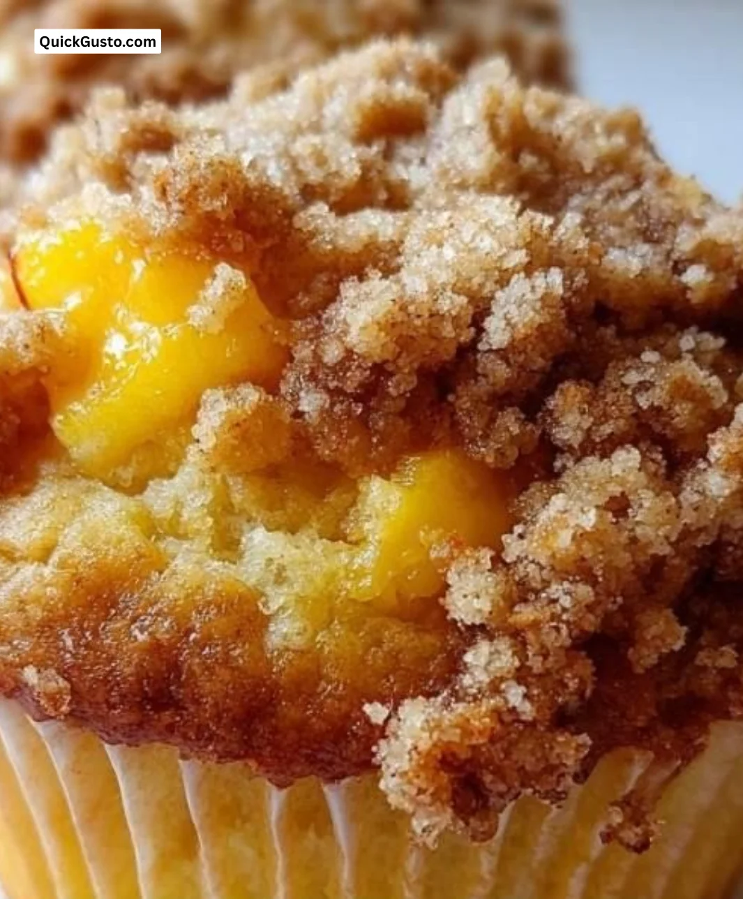 Delicious peach muffins baked to perfection with fresh peaches