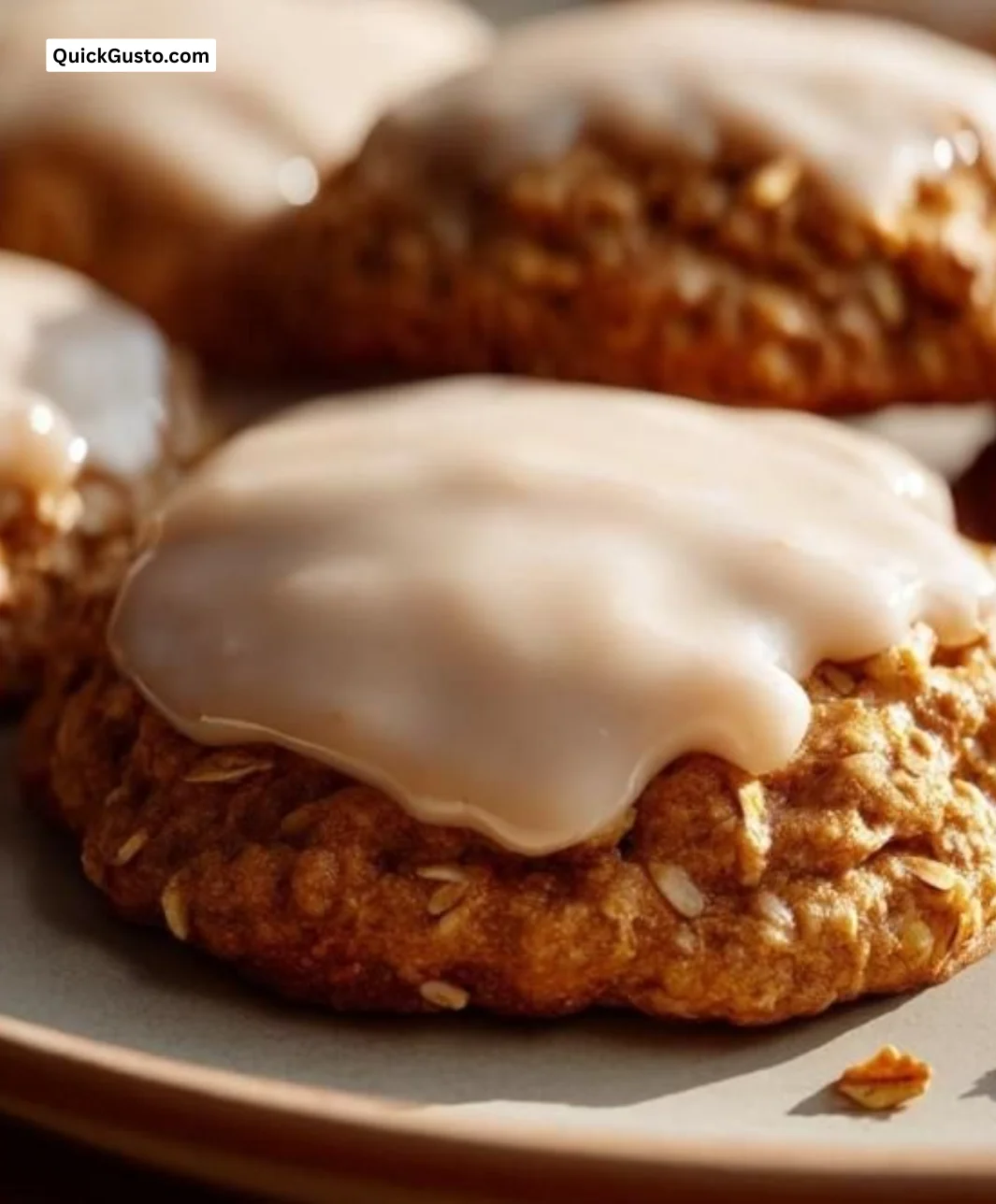Pumpkin Oatmeal Cookies with Maple Frosting on a rustic background