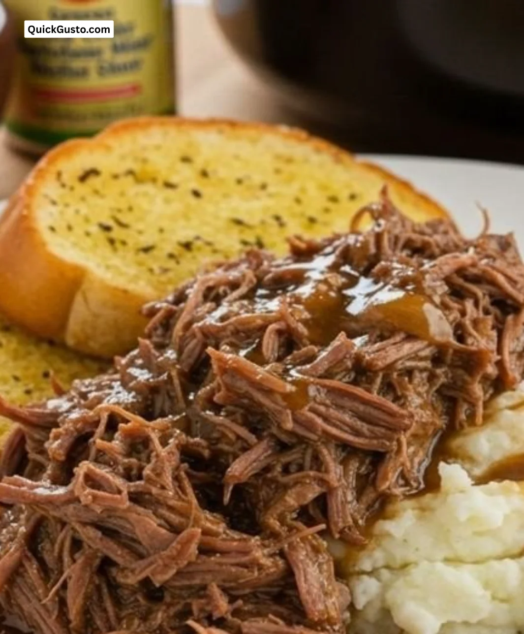 Delicious slow-cooked beef with rich gravy served on a plate